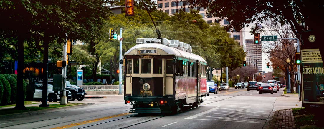 white and brown tram on road during daytime